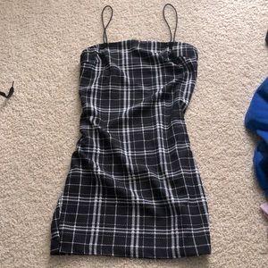 This is a black and white plaid, short dress.